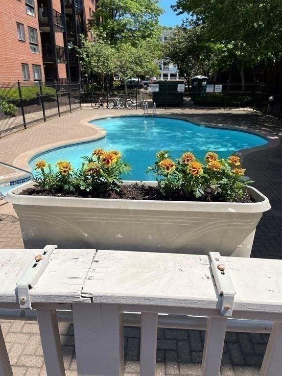50 Rantoul Street, Unit 110 Beverly, MA 01915 - Photo 29 of 37 a view of a garden with flowers