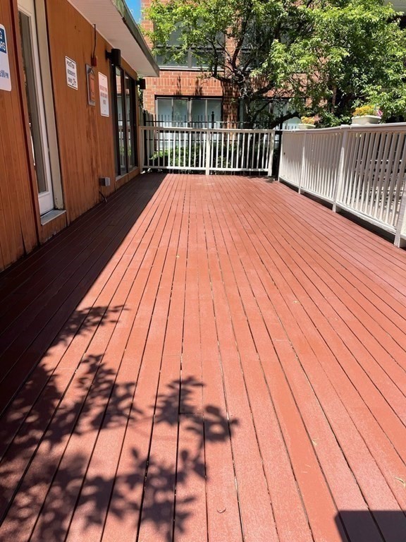 50 Rantoul Street, Unit 110 Beverly, MA 01915 - Photo 32 of 37 a view of backyard with a deck