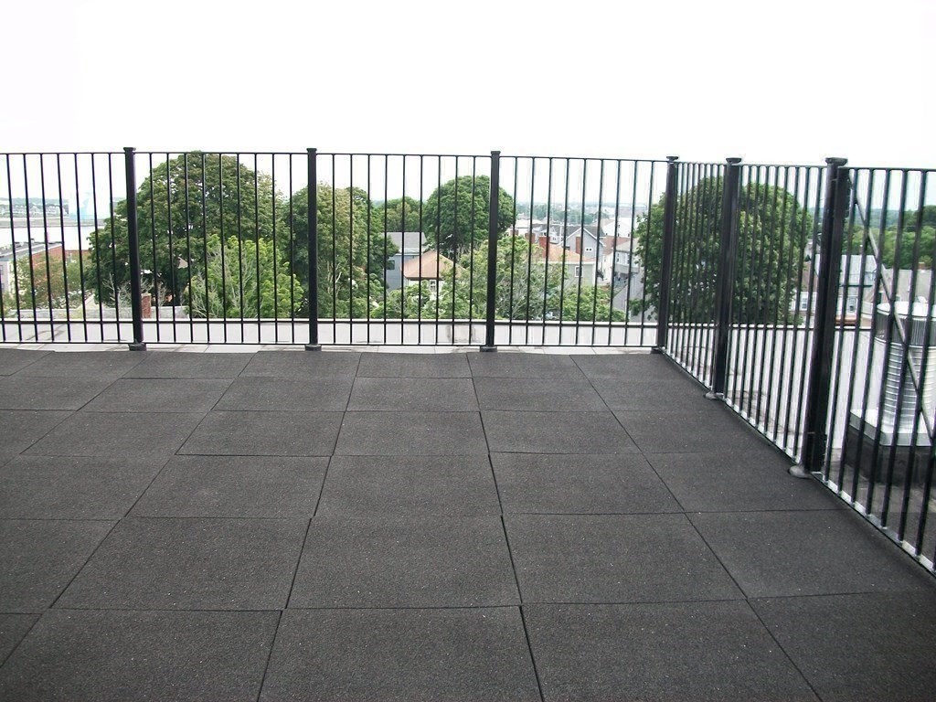 50 Rantoul Street, Unit 110 Beverly, MA 01915 - Photo 36 of 37 a view of a balcony with iron fence
