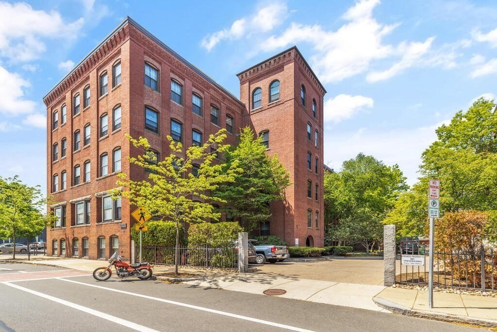 50 Rantoul Street, Unit 110 Beverly, MA 01915 - Photo 4 of 37 a view of a building and a street