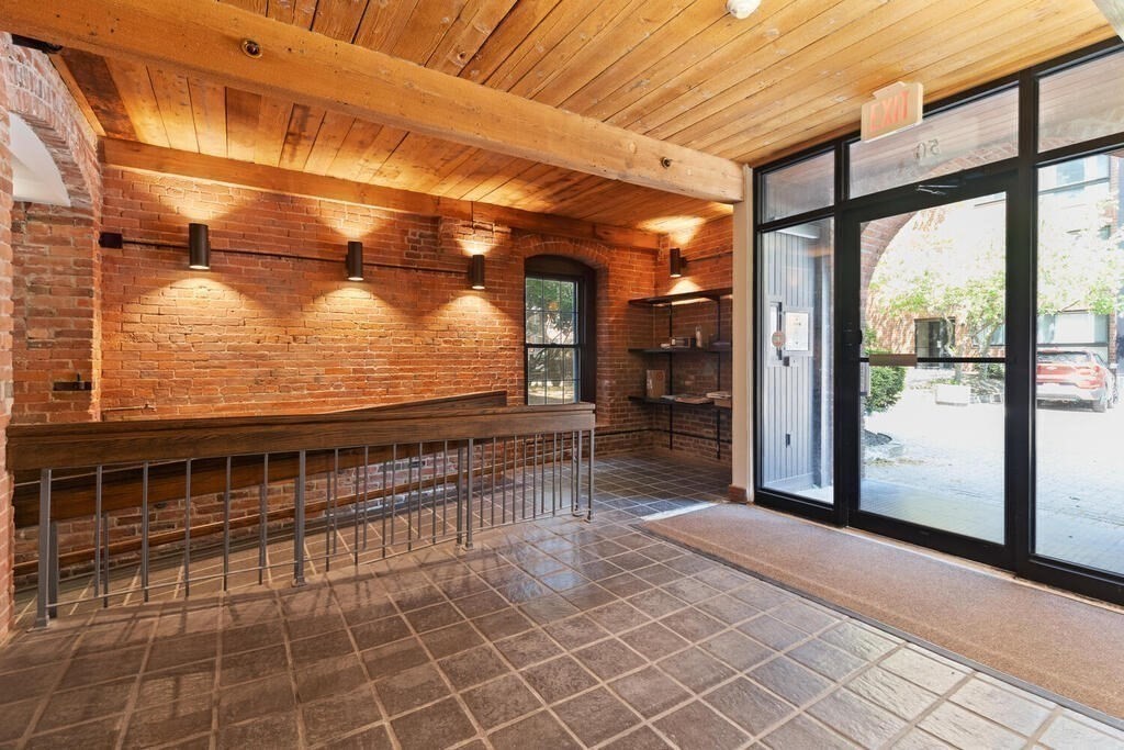 50 Rantoul Street, Unit 110 Beverly, MA 01915 - Photo 8 of 37 a view of a porch with wooden floor