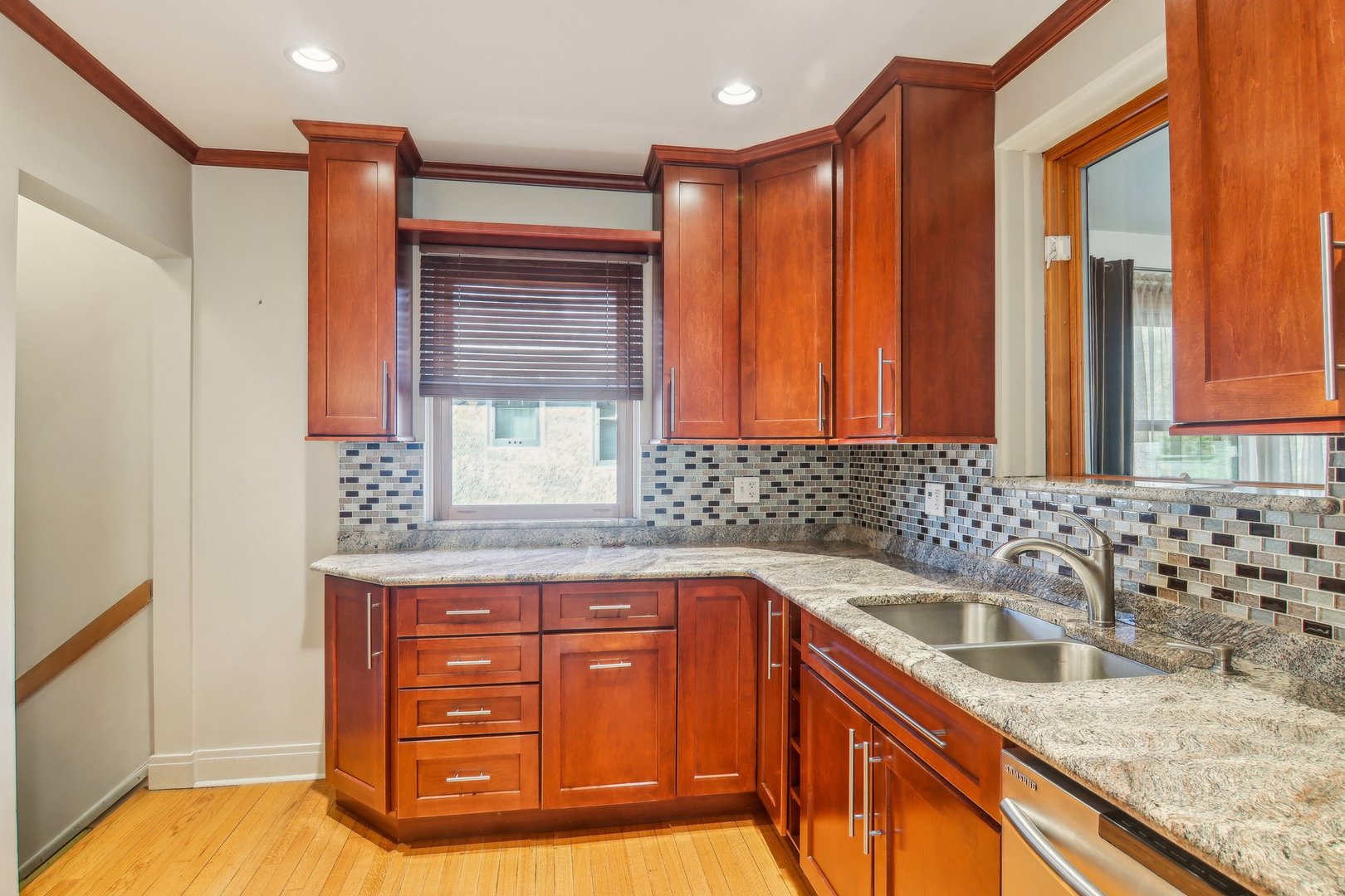 38 Northgate Road Riverside, IL 60546 - Photo 11 of 52 a kitchen with granite countertop a sink and a granite counter tops