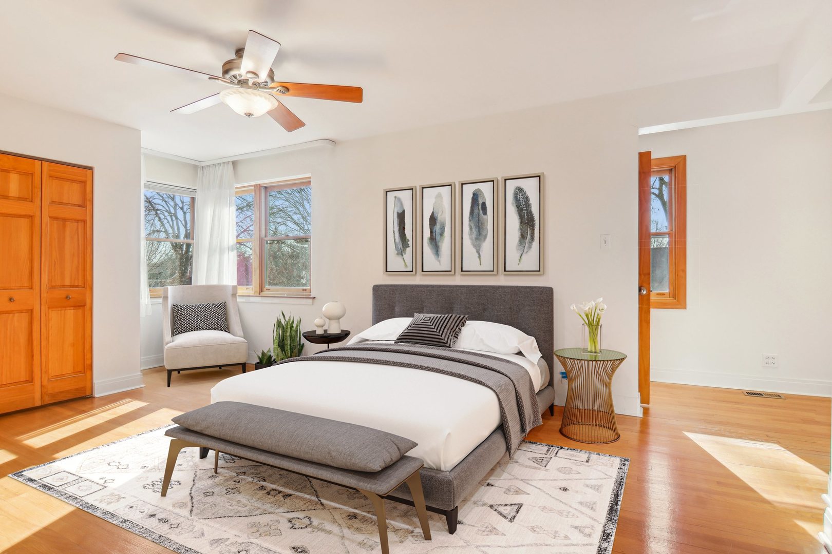 38 Northgate Road Riverside, IL 60546 - Photo 18 of 52 a bedroom with a bed a couch and large windows