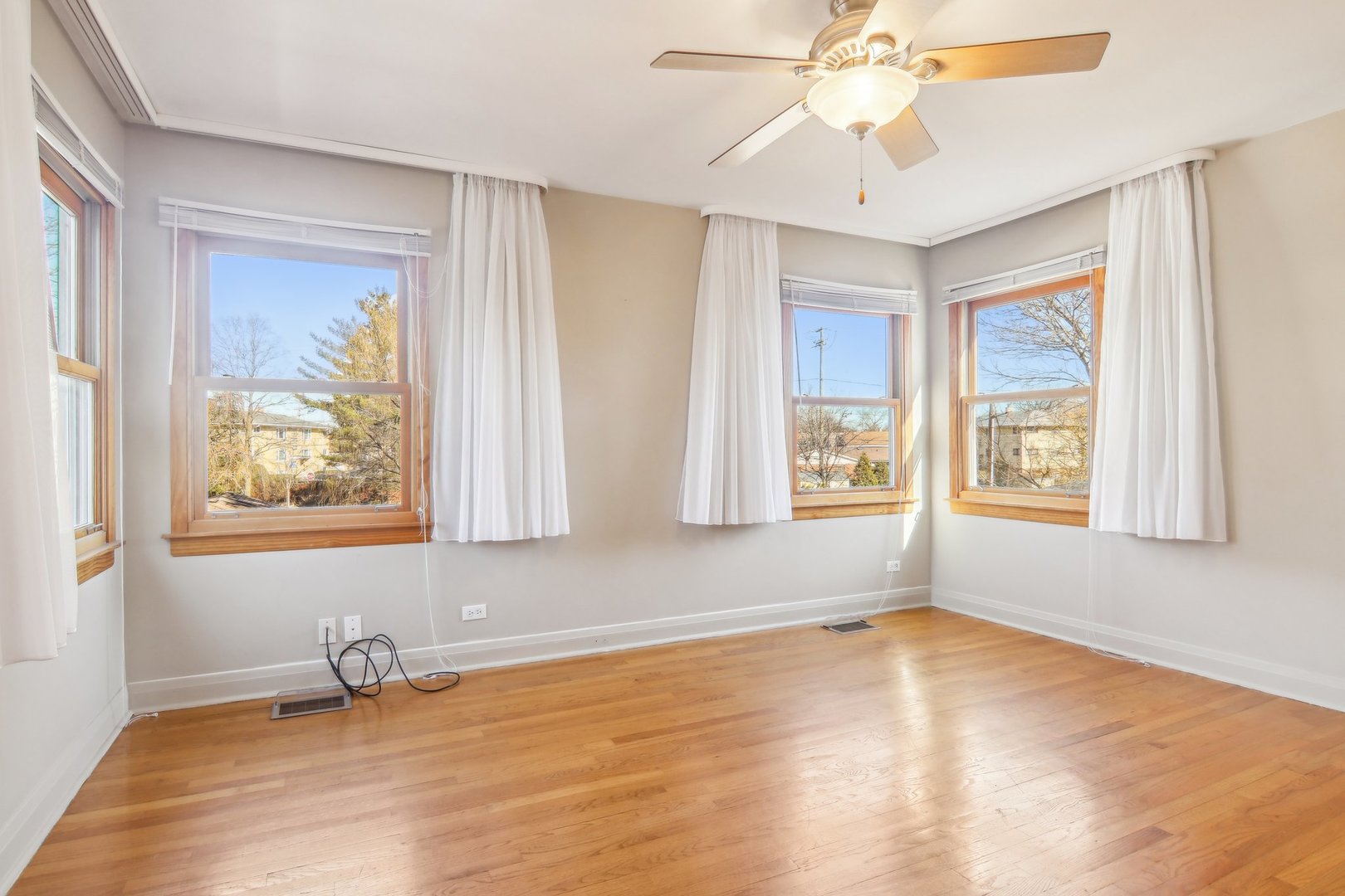 38 Northgate Road Riverside, IL 60546 - Photo 21 of 52 a view of an empty room with wooden floor and a window