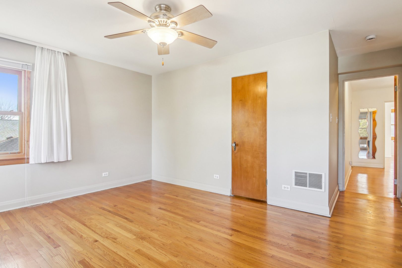 38 Northgate Road Riverside, IL 60546 - Photo 22 of 52 a view of empty room with wooden floor and fan