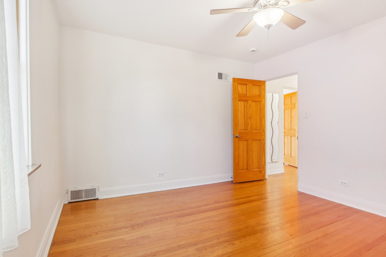 38 Northgate Road Riverside, IL 60546 - Photo 24 of 52 a view of an empty room with wooden floor and a window