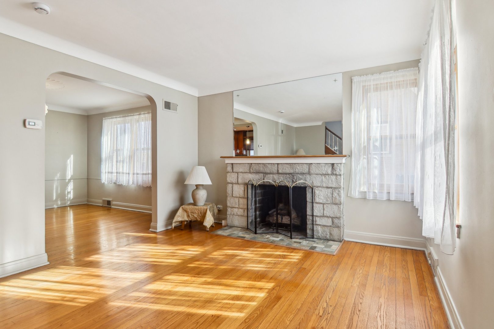 38 Northgate Road Riverside, IL 60546 - Photo 7 of 52 a view of a livingroom with wooden floor and a fireplace