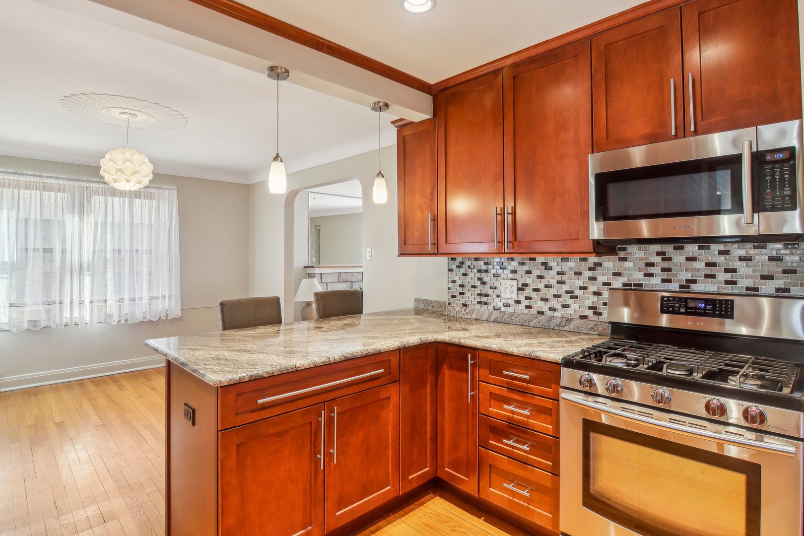 38 Northgate Road Riverside, IL 60546 - Photo 10 of 52 a kitchen with granite countertop cabinets stainless steel appliances and a counter space