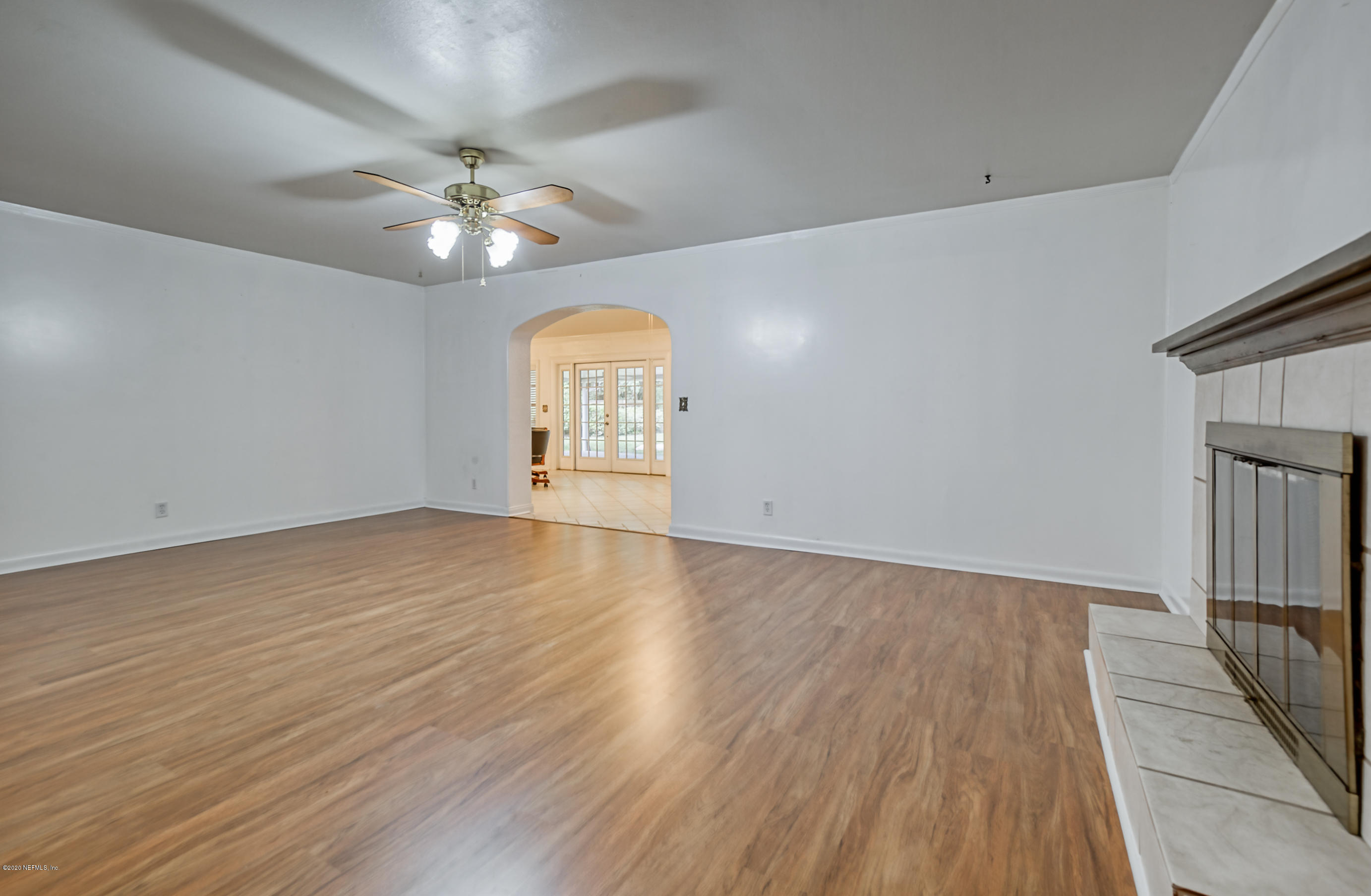 4024 Heath Road Jacksonville, FL 32277 - Photo 23 of 37 wooden floor in an empty room with a window