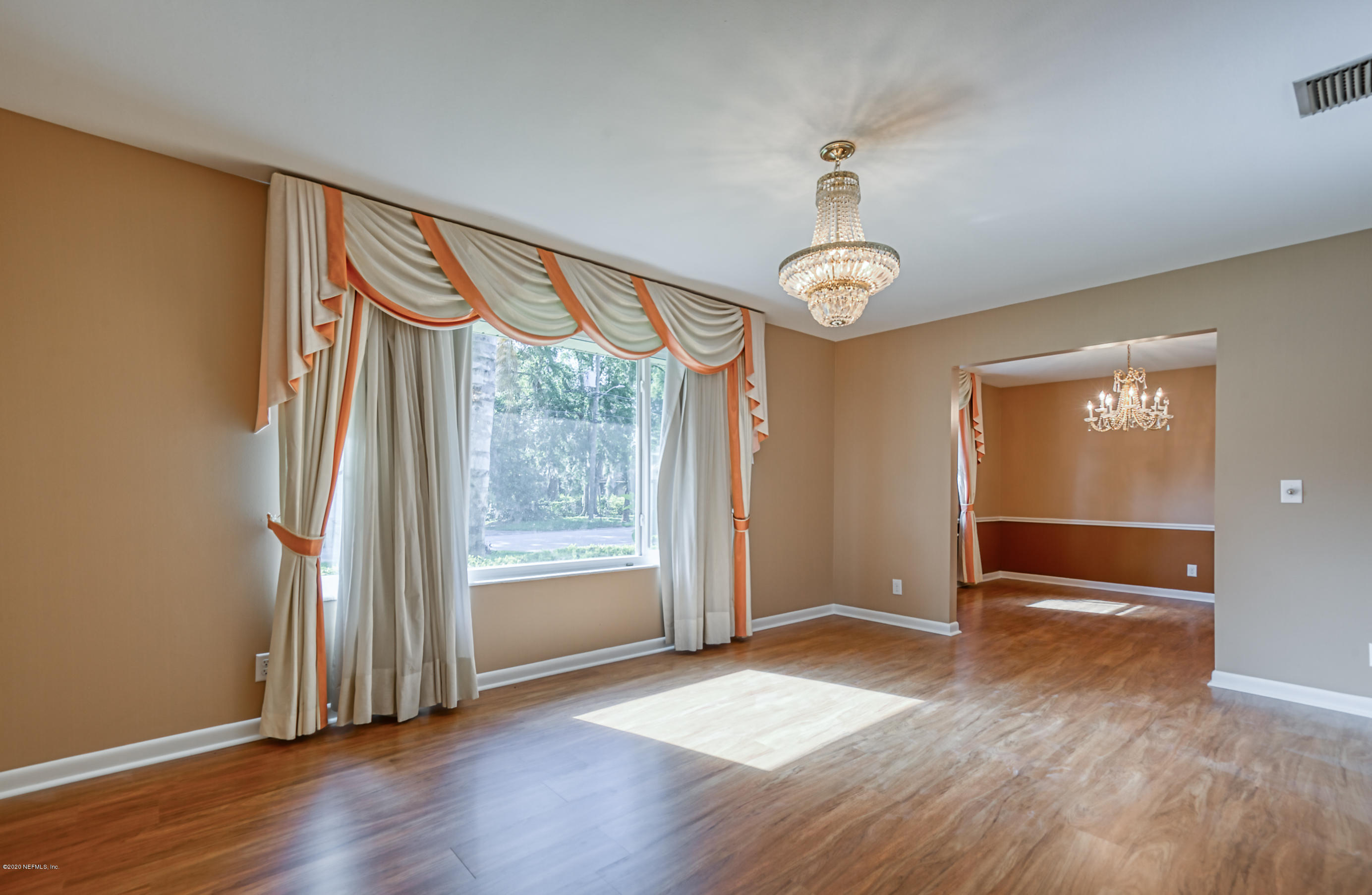 4024 Heath Road Jacksonville, FL 32277 - Photo 33 of 37 an empty room with wooden floor and windows