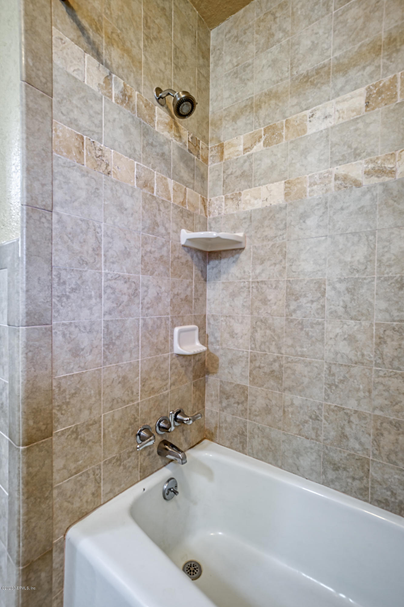 4024 Heath Road Jacksonville, FL 32277 - Photo 7 of 37 a bathroom with a sink and a shower