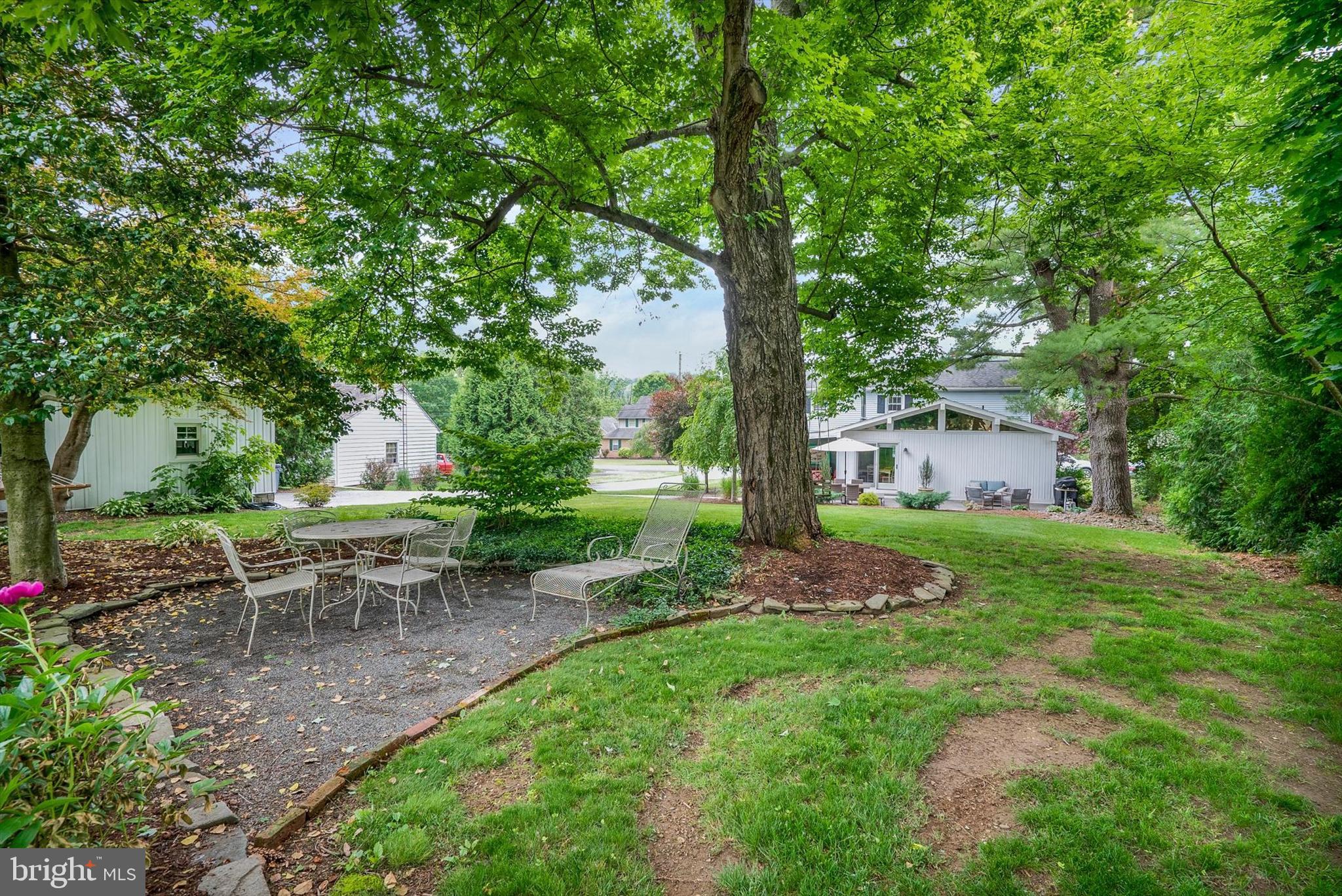 53 Main Street Oley, PA 19547 - Photo 6 of 26 a view of a backyard with table and chairs and a tree