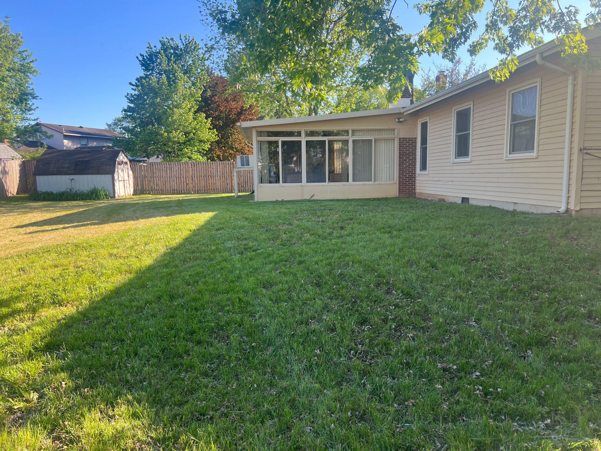 8871 Butternut Street Manassas, VA 20110 - Photo 26 of 29 a view of a house with a backyard