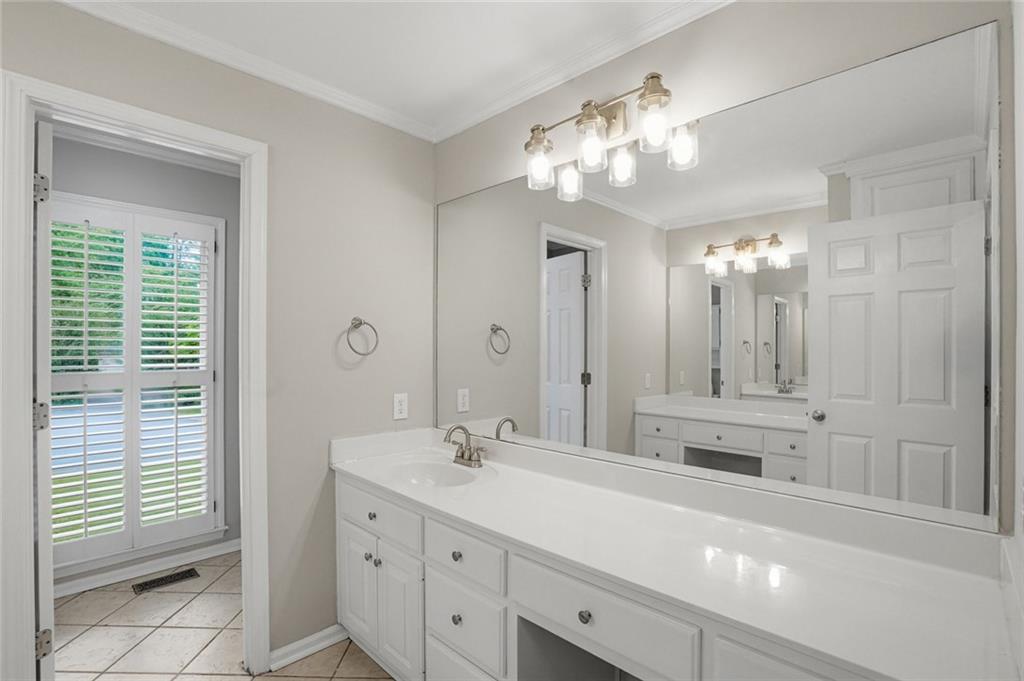 13 Bedford Ridge Northwest Cartersville, GA 30121 - Photo 12 of 19 a spacious bathroom with a sink a large mirror and a shower