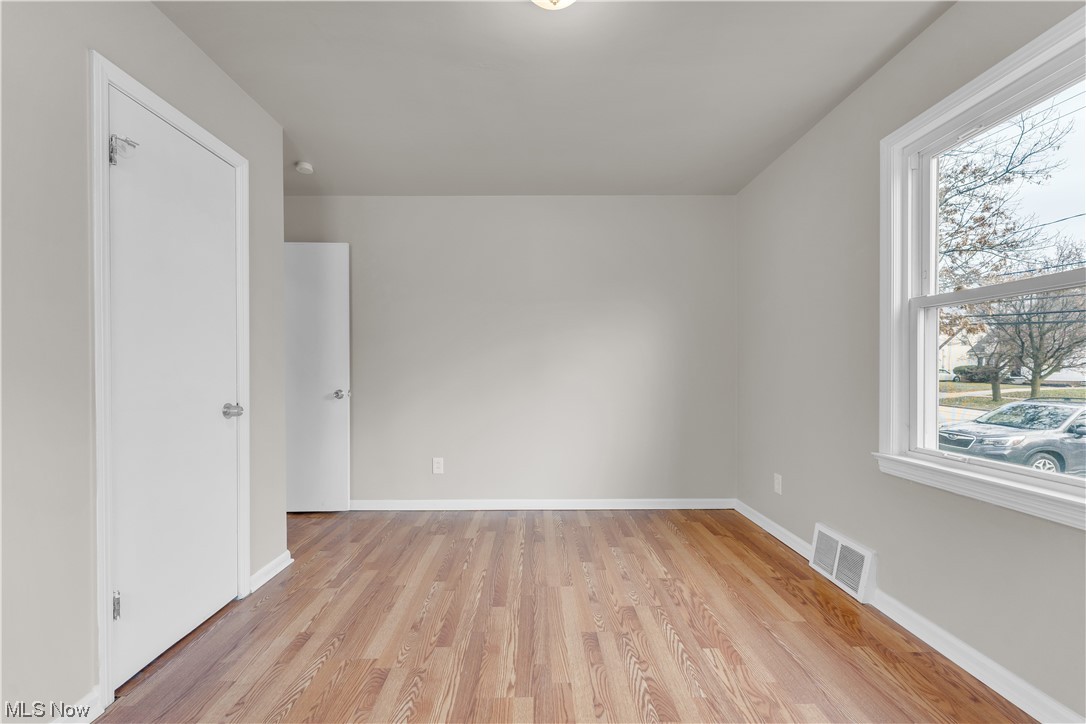 16301 Turney Road Maple Heights, OH 44137 - Photo 33 of 35 Spare room featuring light wood-type flooring and plenty of natural light