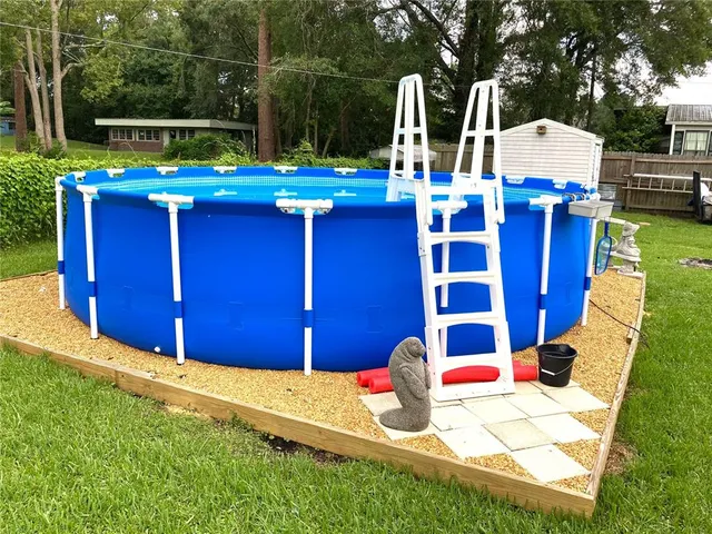 a view of swimming pool with a patio