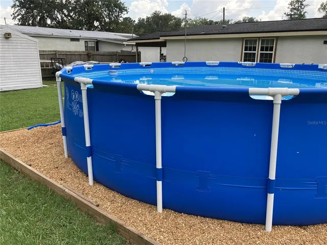 a view of a house with a sink and outdoor seating