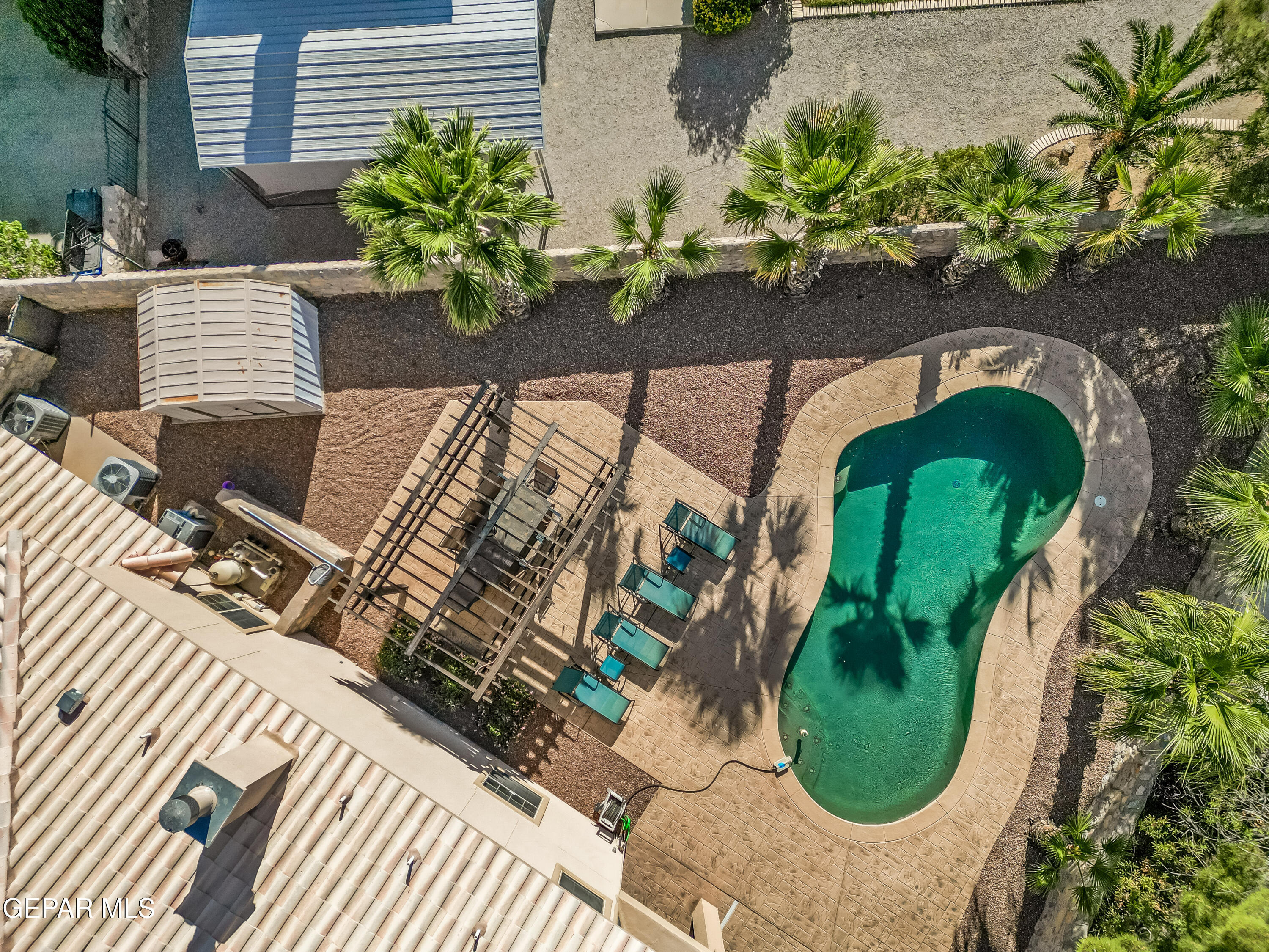 1109 Noble Ridge Way El Paso, TX 79912 - Photo 73 of 73 drone-pool, lounging, dining pergola
