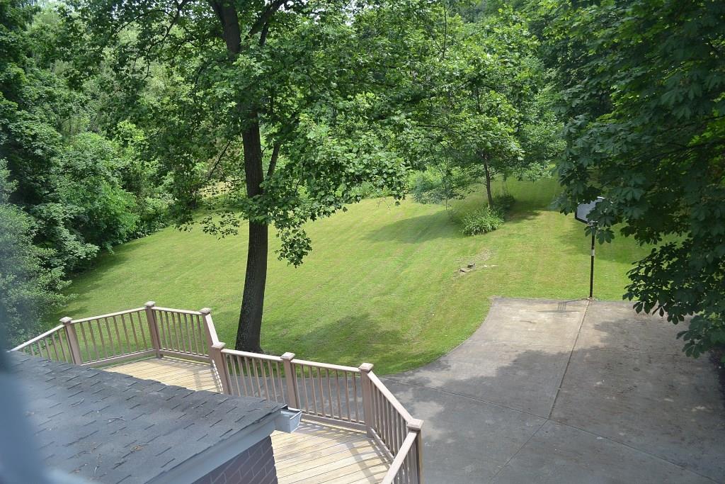 5600 Meridian Road Gibsonia, PA 15044 - Photo 25 of 25 View of the deck and the yard (from the second floor den). Notice the two car pull-off by the basketball hoop. There is another two car pull-off by the side steps, and plenty of space in between for play or parking. Really want more garage space? Move the hoop and add a garage!