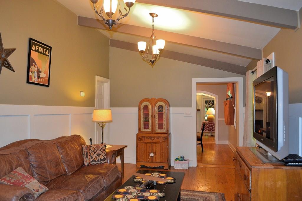 5600 Meridian Road Gibsonia, PA 15044 - Photo 8 of 25 Two chandeliers brighten up the space, in the evening, but there's plenty of sunshine beaming through the four windows, during the day. The door on the left in the rear of this room, leads to a full bath that is also en suite with the Master Bedroom. The view through the archways is expansive.