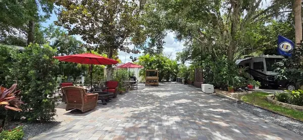 an outdoor space with furniture and umbrella