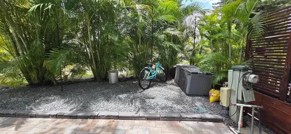 a view of a backyard with trees