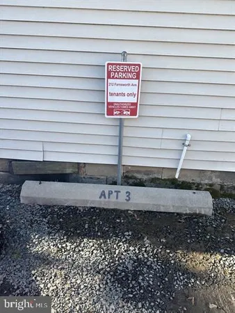 a view of a pathway besides a house