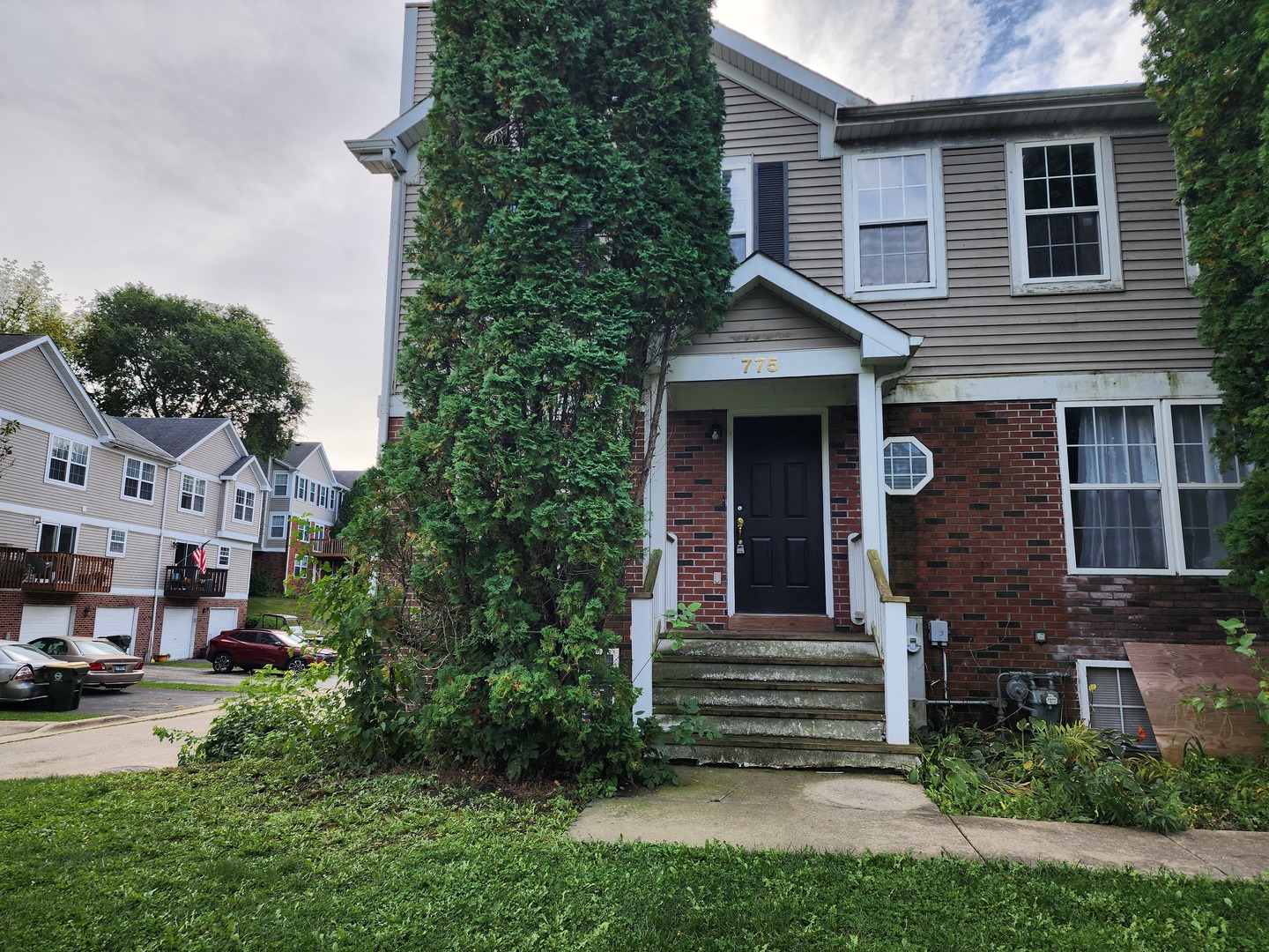 a front view of a house with a yard