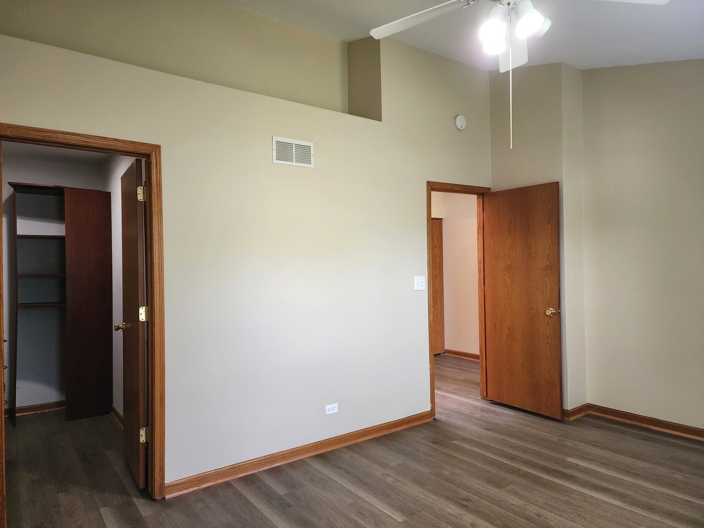 775 Highview Court Antioch, IL 60002 - Photo 12 of 16 a view of an empty room with wooden floor and a mirror