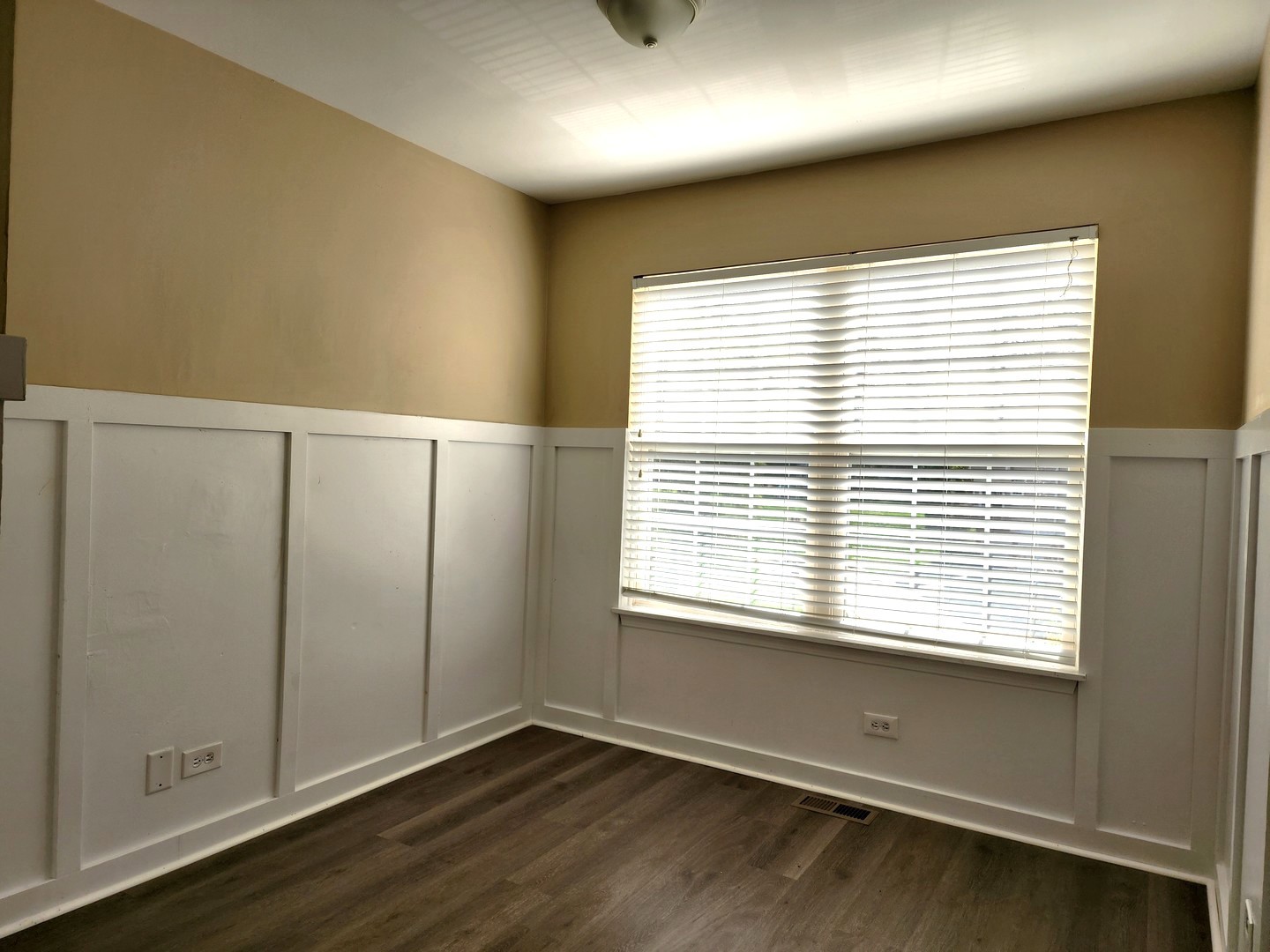 775 Highview Court Antioch, IL 60002 - Photo 15 of 16 a view of an empty room with wooden floor and a window