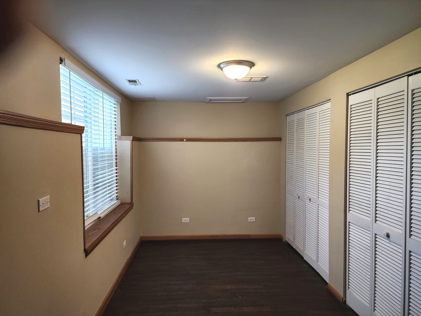775 Highview Court Antioch, IL 60002 - Photo 16 of 16 an empty room with wooden floor and windows