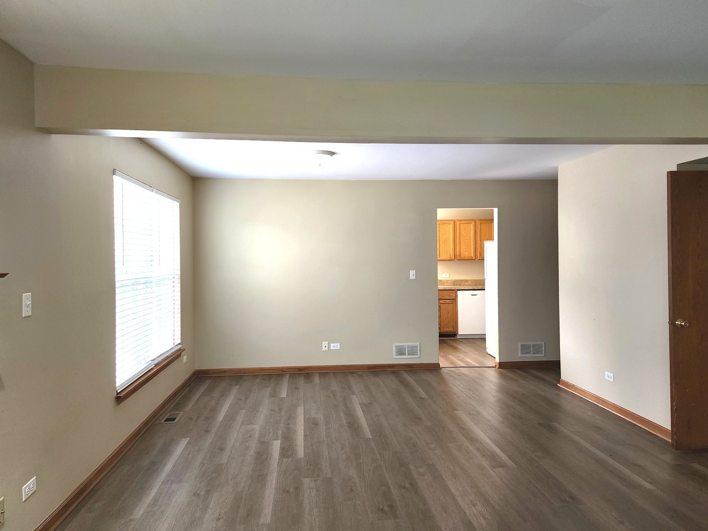 775 Highview Court Antioch, IL 60002 - Photo 4 of 16 an empty room with wooden floor and windows