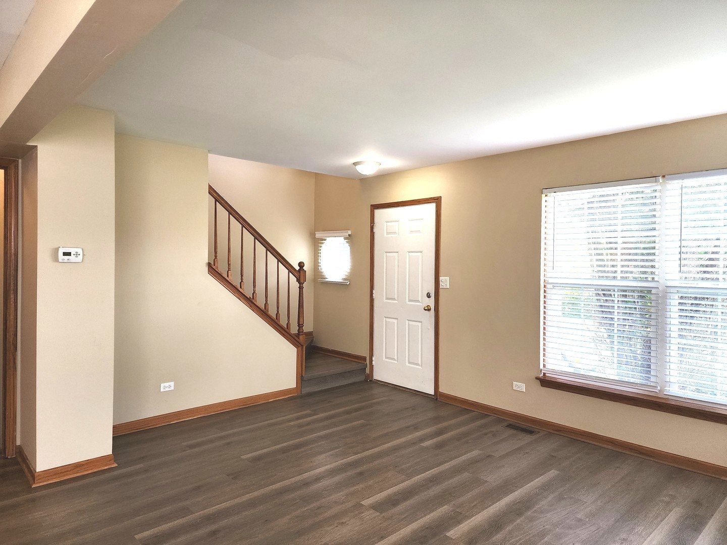775 Highview Court Antioch, IL 60002 - Photo 5 of 16 a view of an empty room with wooden floor and a window