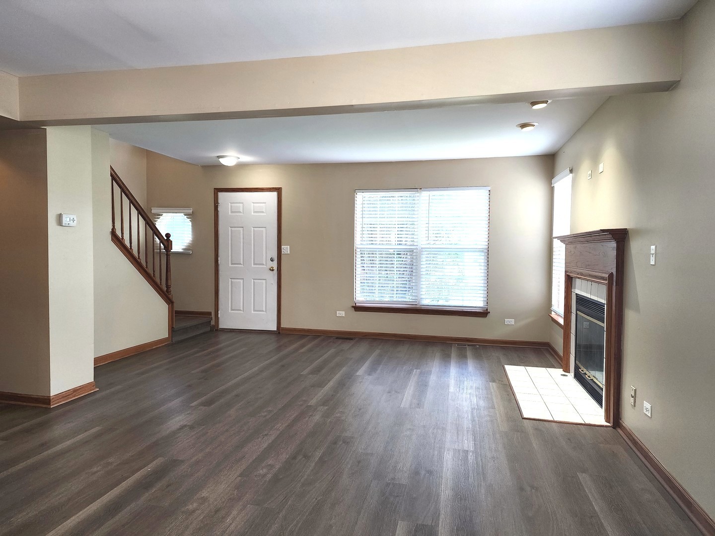 775 Highview Court Antioch, IL 60002 - Photo 6 of 16 an empty room with wooden floor and windows