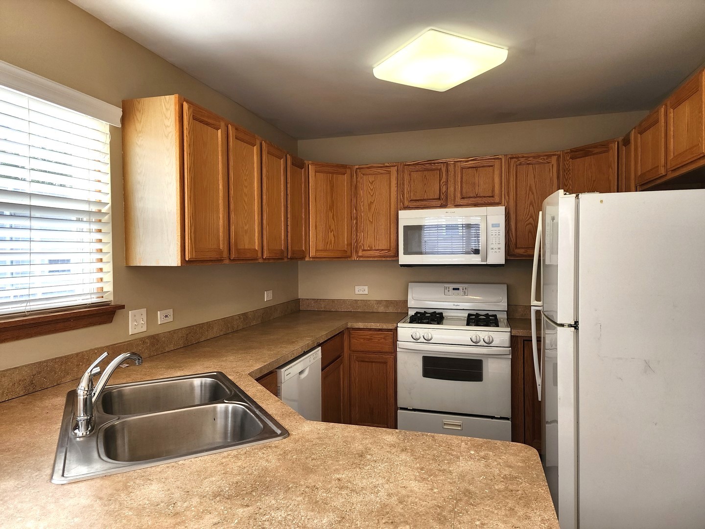 775 Highview Court Antioch, IL 60002 - Photo 7 of 16 a kitchen with a refrigerator sink and microwave