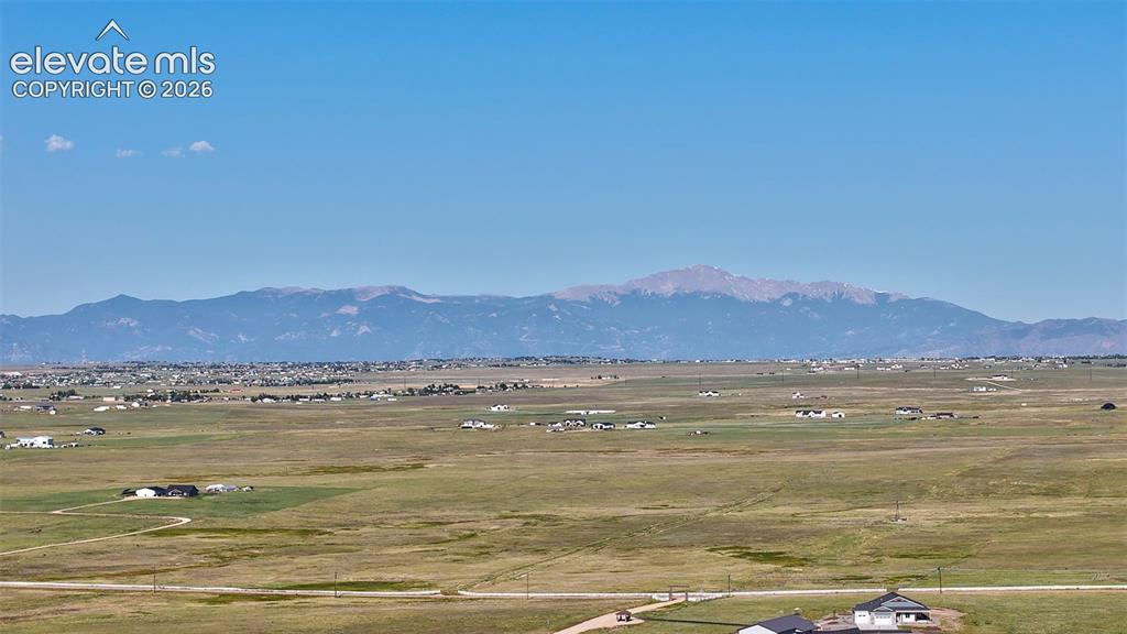 8007 Wrangler Ranch View Peyton, CO 80831 - Photo 1 of 9 Expansive landscape featuring distant mountains and open terrain