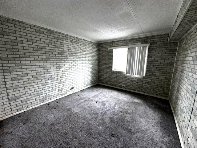 17005 Albany Avenue, Unit 102 Hazel Crest, IL 60429 - Photo 12 of 13 a view of an empty room and window