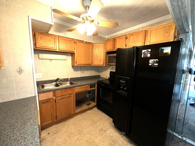 17005 Albany Avenue, Unit 102 Hazel Crest, IL 60429 - Photo 6 of 13 a kitchen with stainless steel appliances granite countertop a refrigerator a stove and a sink