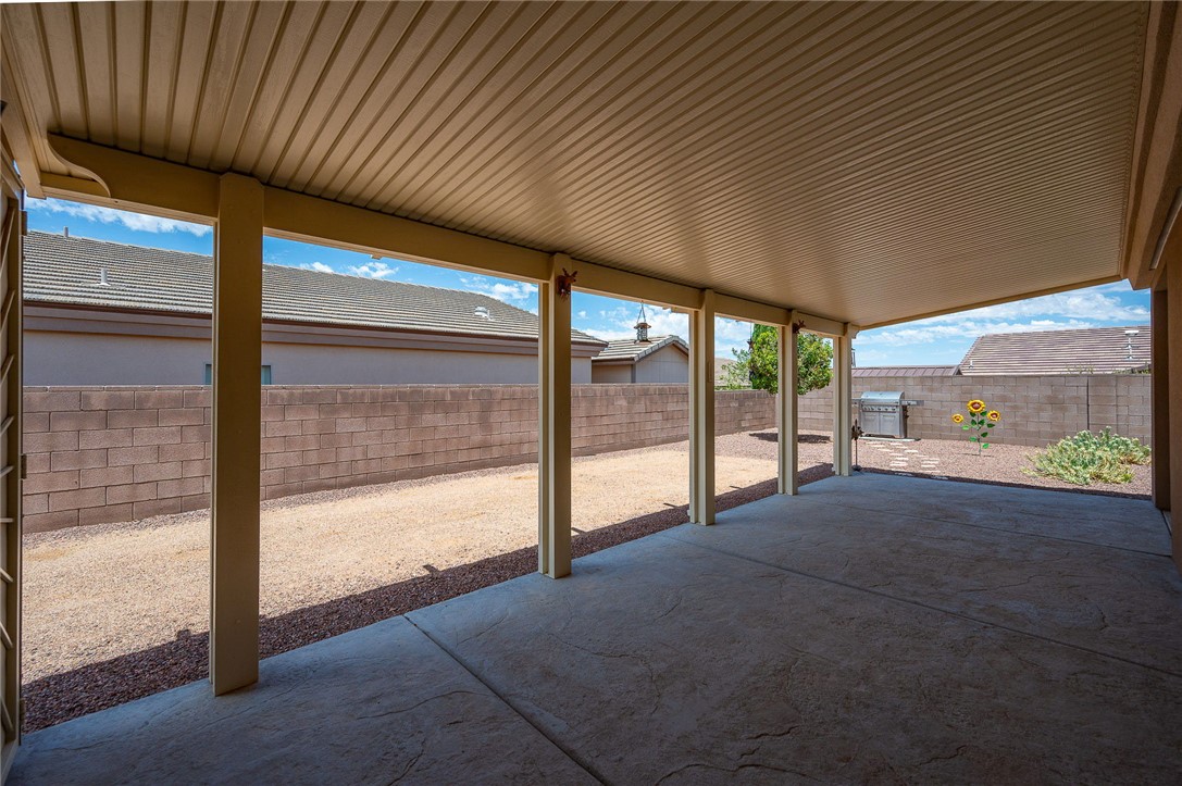 3319 Motherload Road Kingman, AZ 86401 - Photo 33 of 53 View of extended, upgraded covered patio / terrace for extra shade and completely fenced backyard.
