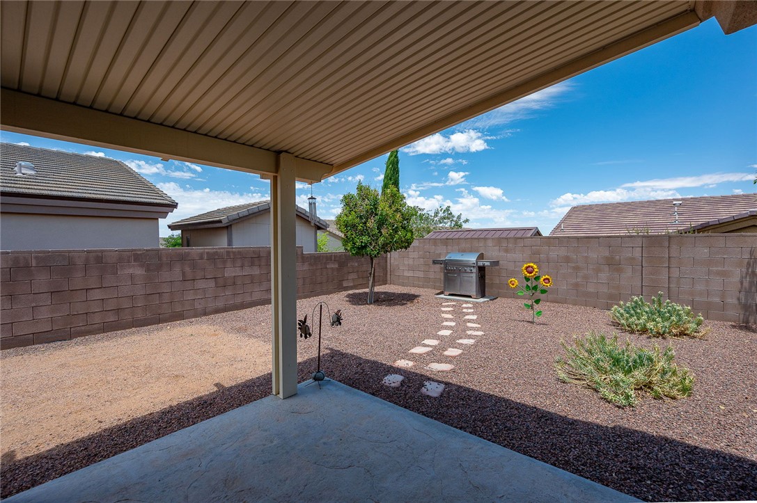 3319 Motherload Road Kingman, AZ 86401 - Photo 34 of 53 View of extended, upgraded covered patio / terrace for extra shade and completely fenced backyard.