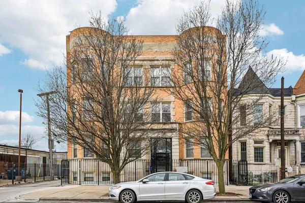 a view of a cars parked on the side of a street