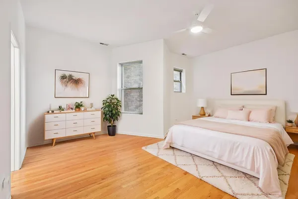 a bedroom with a bed and a dresser