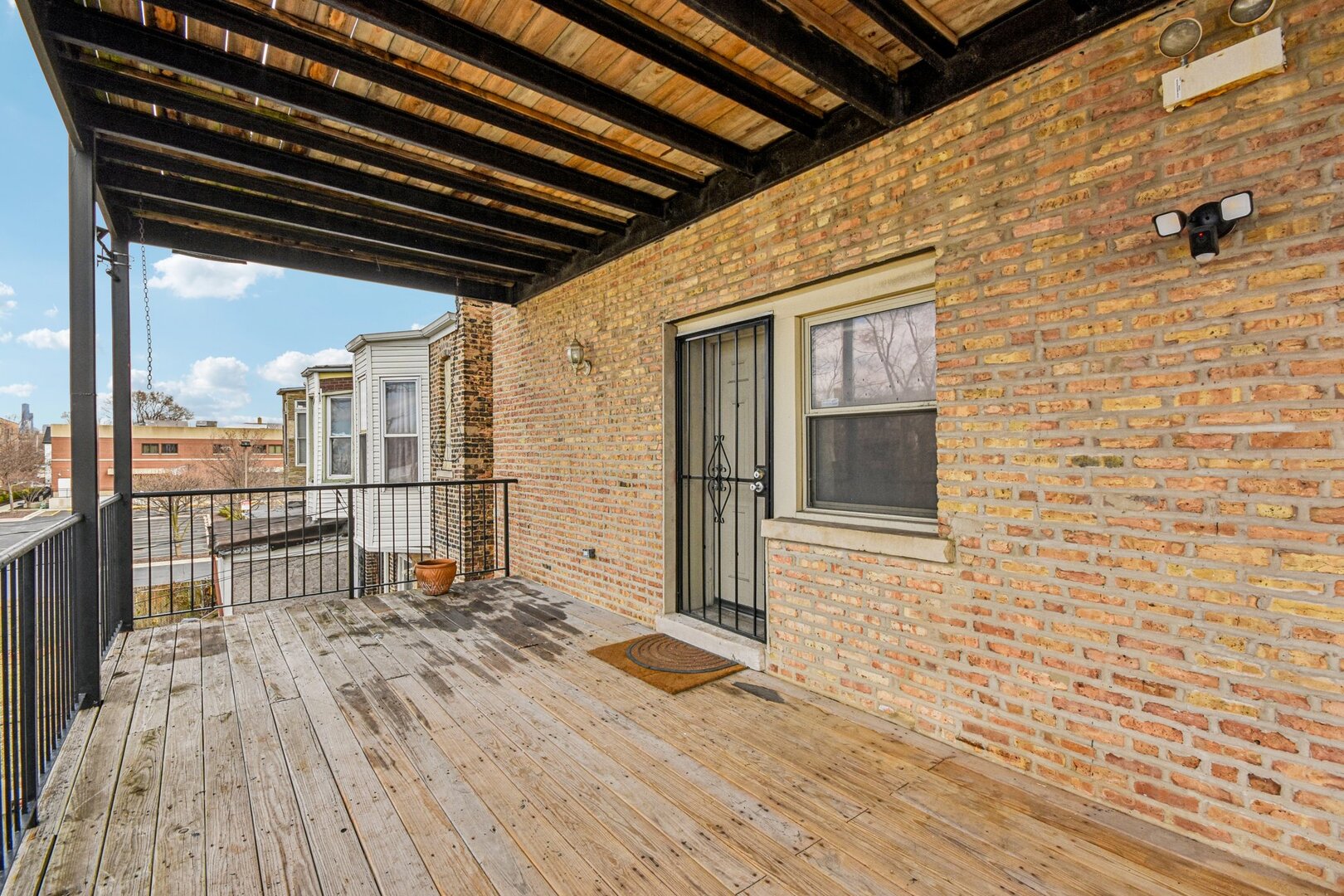 4644 South Prairie Avenue, Unit 2N Chicago, IL 60653 - Photo 21 of 25 a view of a porch with wooden floor and fence