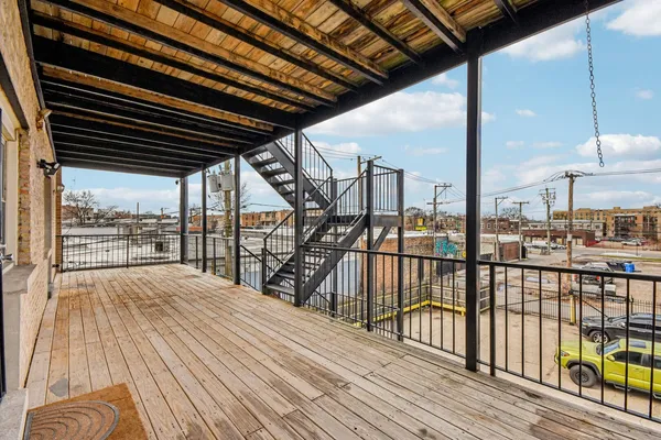 a view of balcony with wooden floor