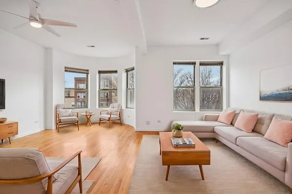 a living room with furniture and a large window