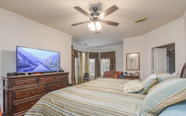 a bathroom with a double vanity sink large mirror and a bathtub
