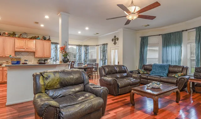 a living room with furniture and a large window