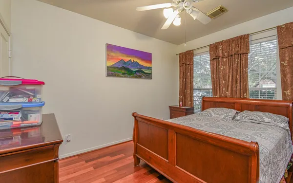 a bedroom with a bed and a dresser