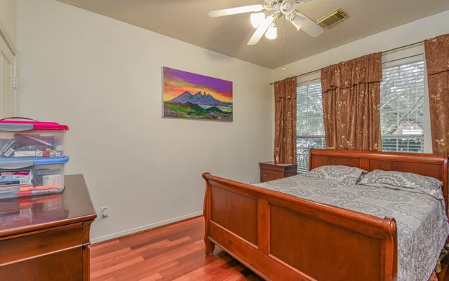 a bedroom with a bed and a dresser