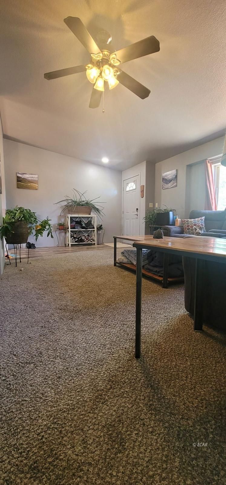 933 Spring Valley Parkway Spring Creek, NV 89815 - Photo 17 of 27 a room with lots of counter space and chandelier